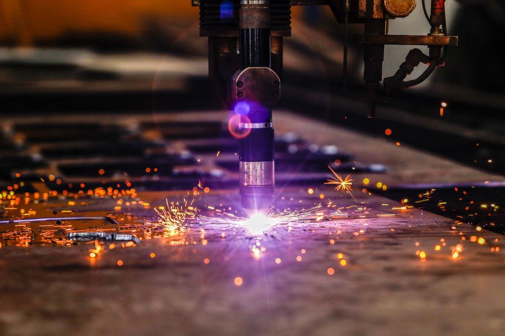 Plasma Cutter Cutting Metal Sheet — Bryants Laser Works in Logan, QLD