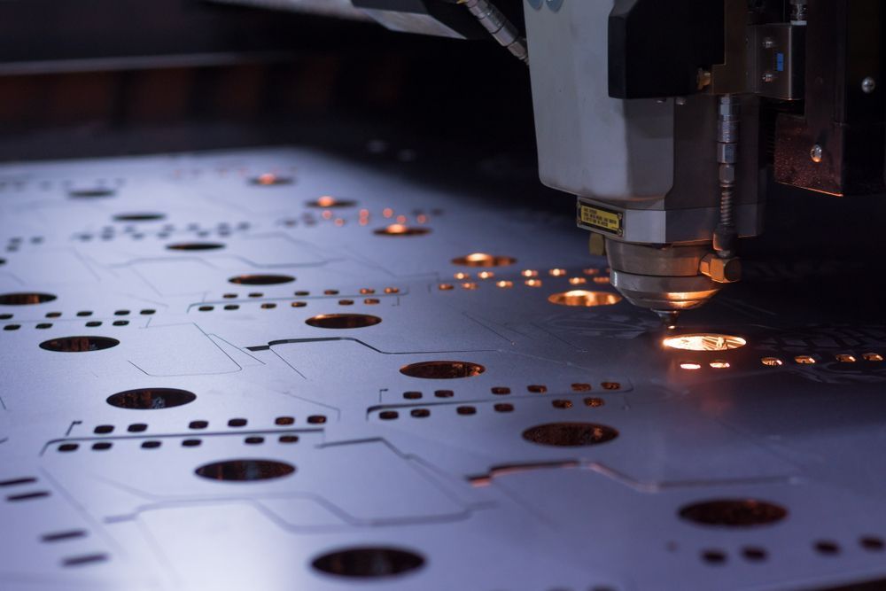 Laser Cutter Precisely Cutting a Metal Sheet — Bryants Laser Works in Logan, QLD