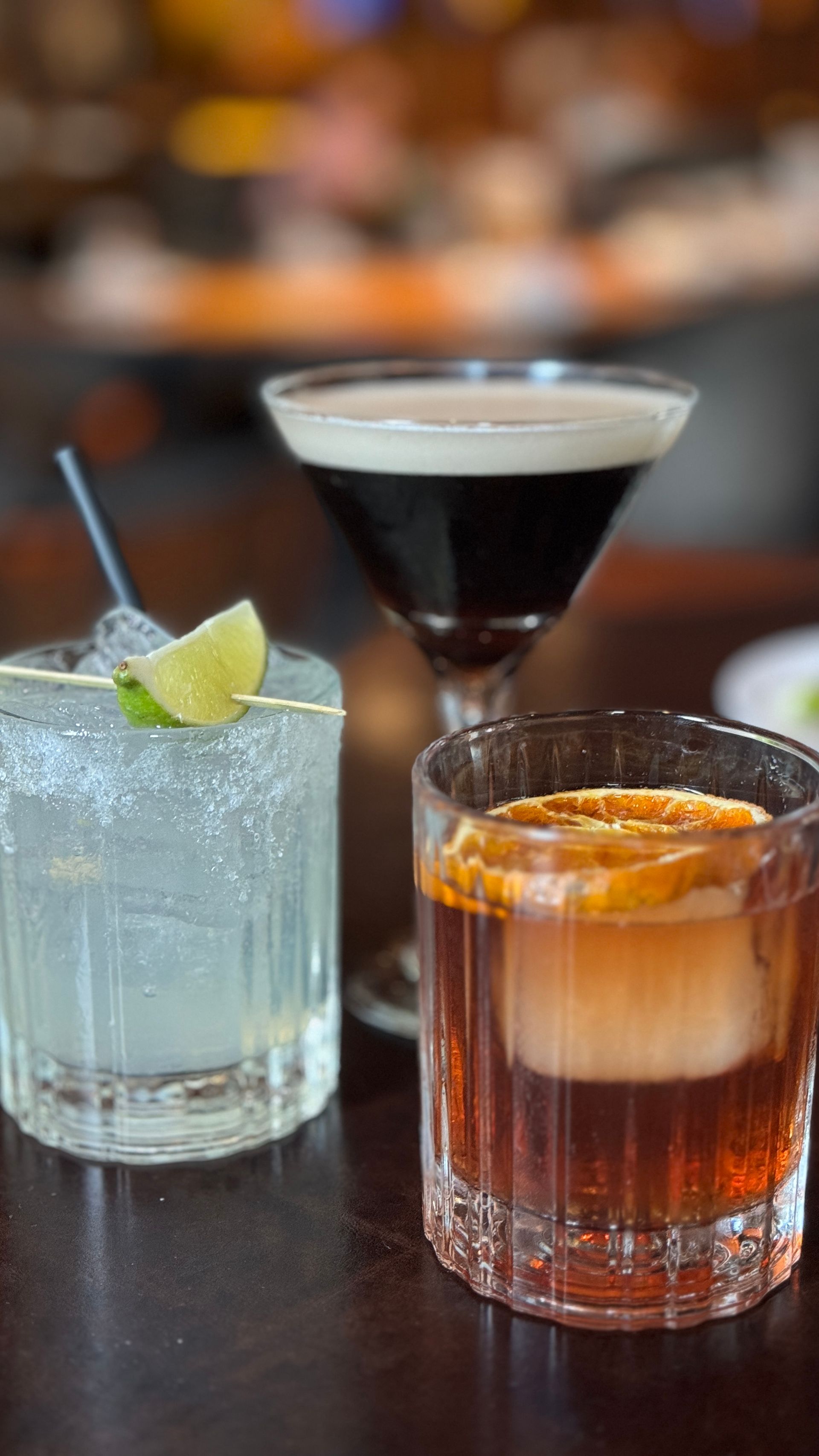 Three different types of drinks are sitting on a table.