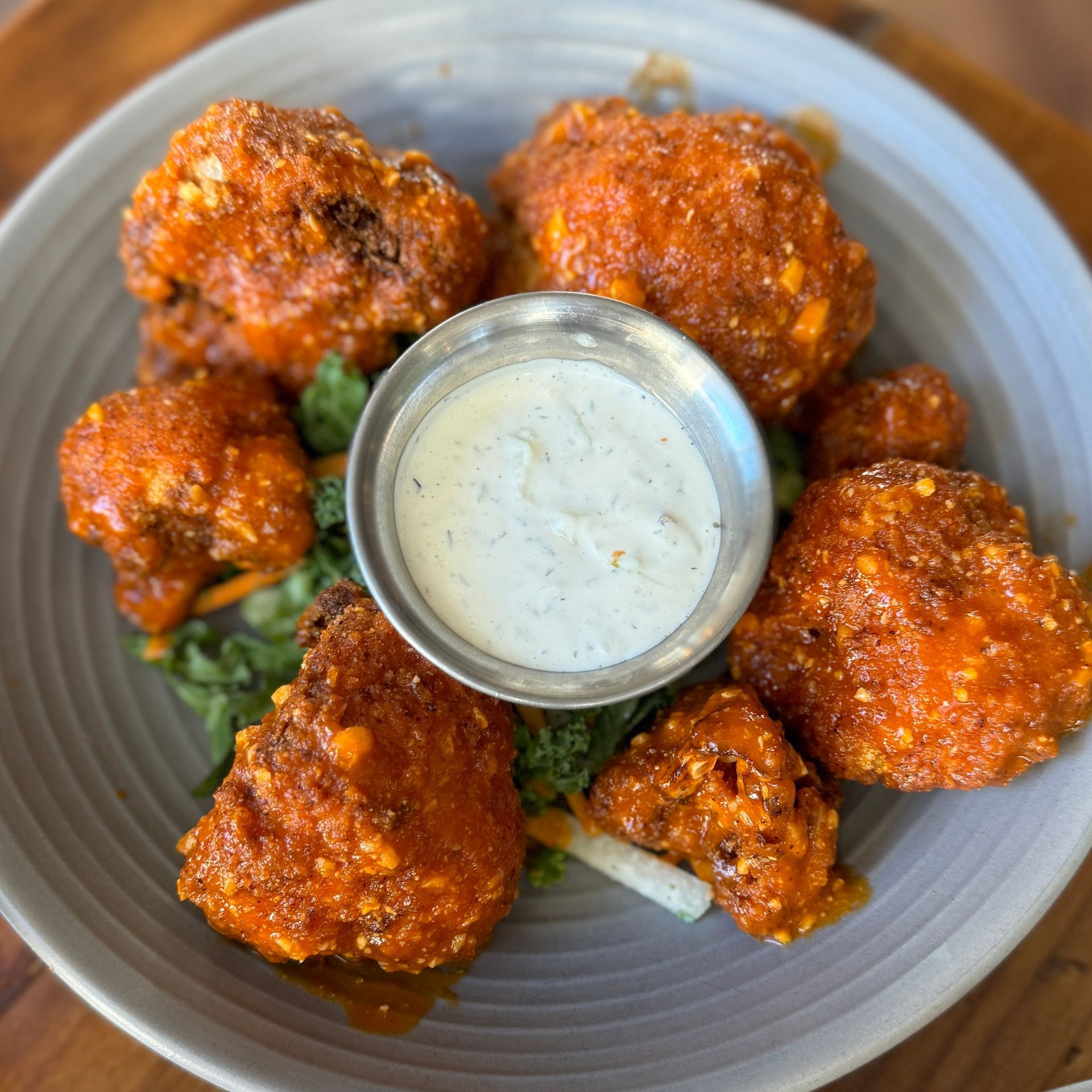 Cook & Craft - A close up of a plate of food with a bowl of ranch dressing