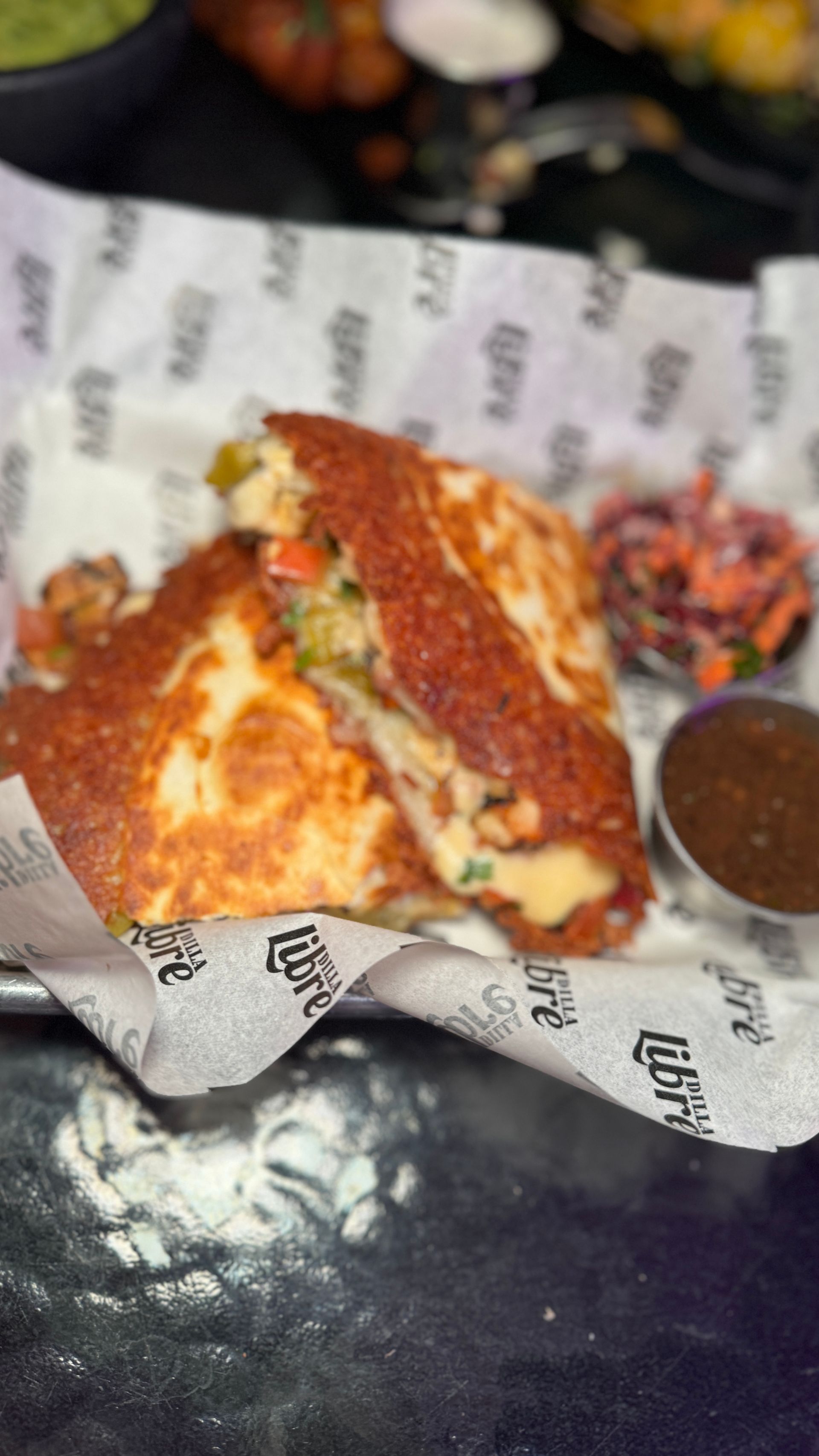A close up of a sandwich on a plate on a table.