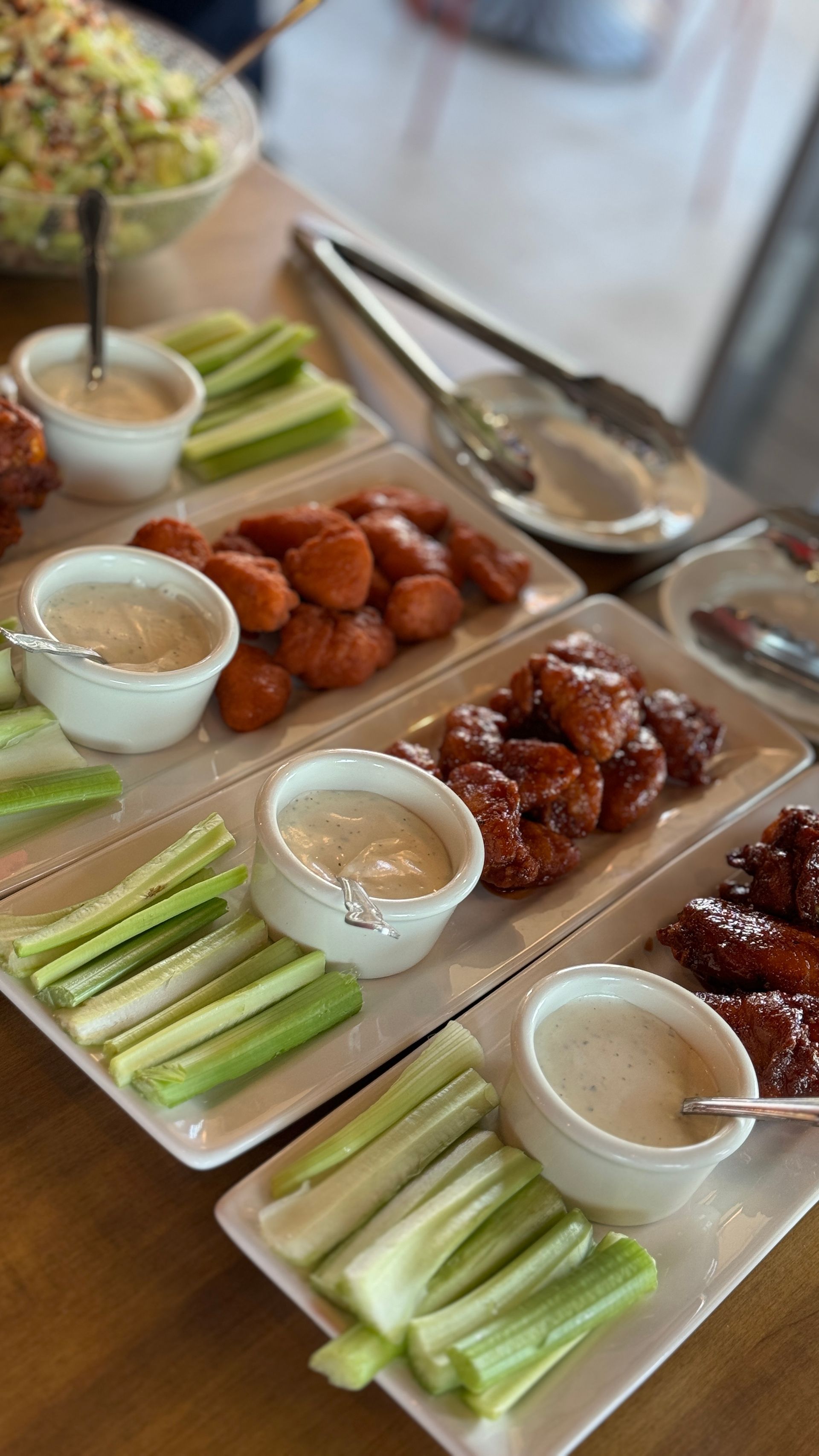 There are many different types of food on the plates on the table.