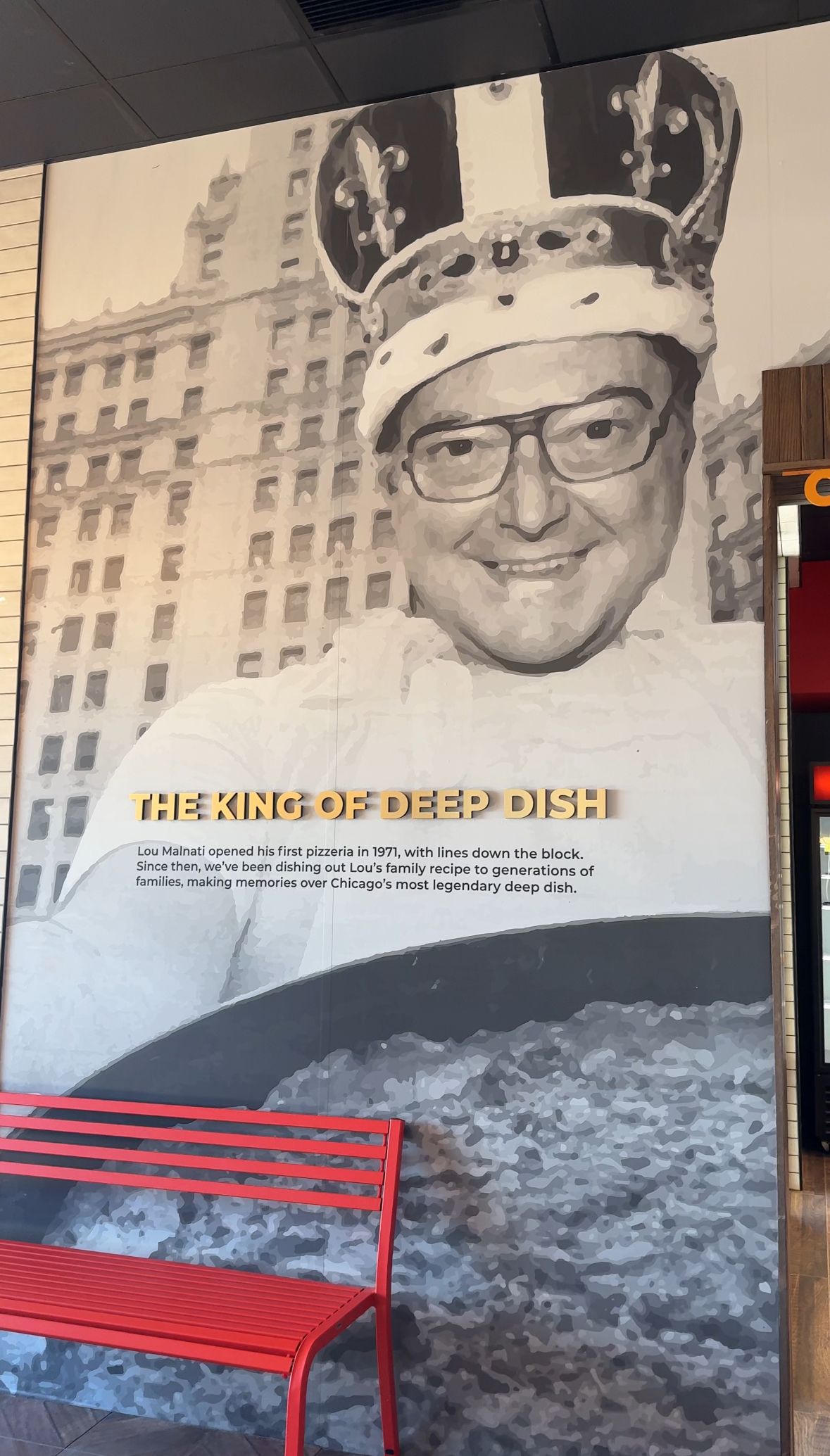 A black and white photo of a man wearing a crown