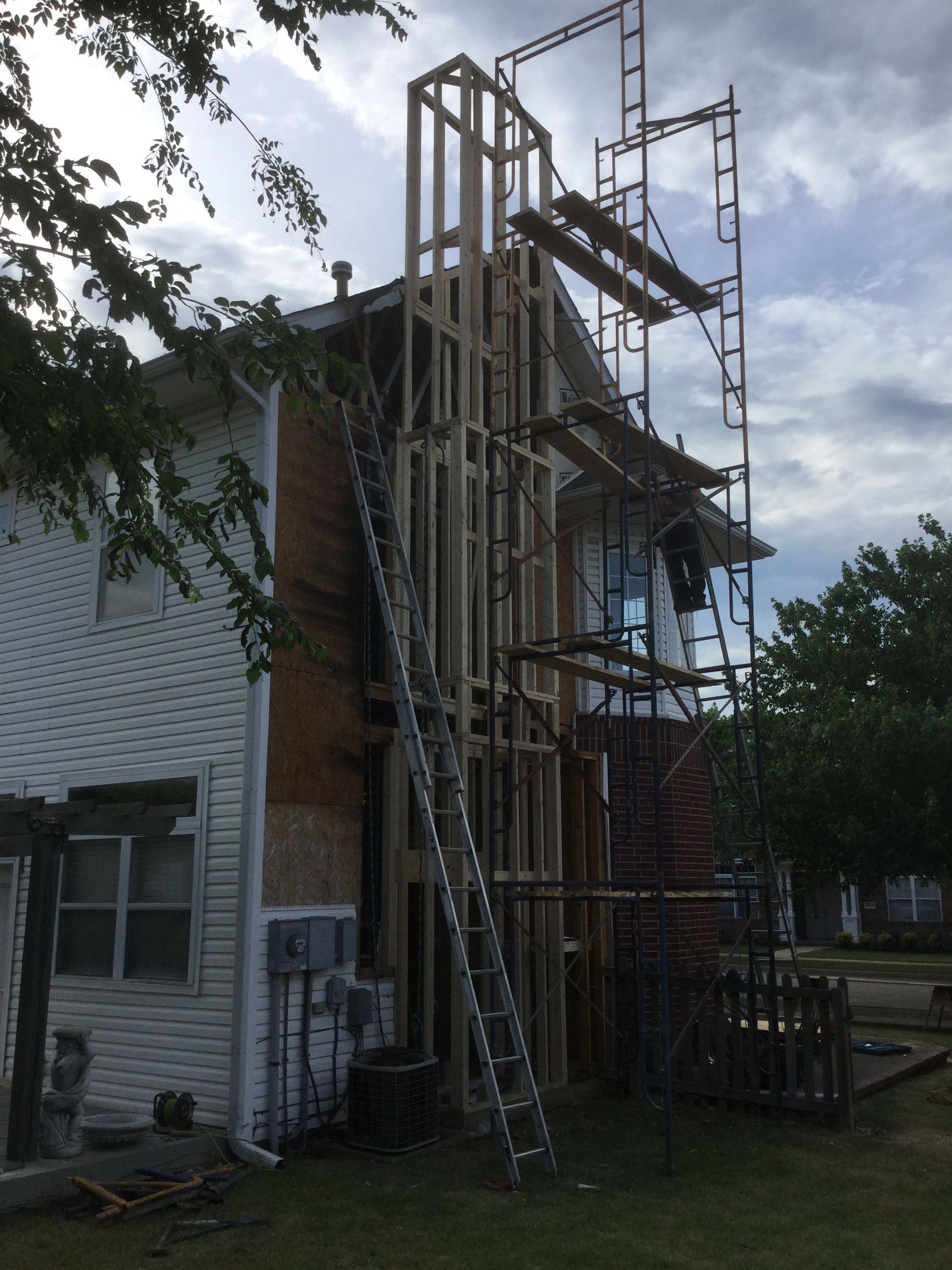 Abstract illustration of a landscape with a mountain and a sun, all in shades of gray.