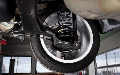 tyre and brake repair of a car in a garage
