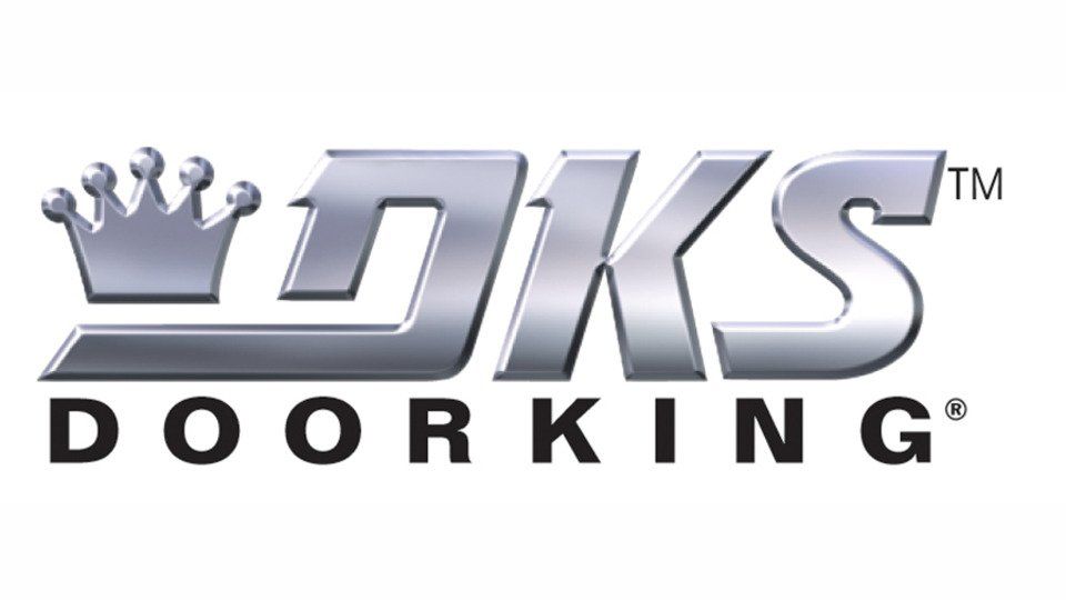 The logo for dks door king has a crown on it