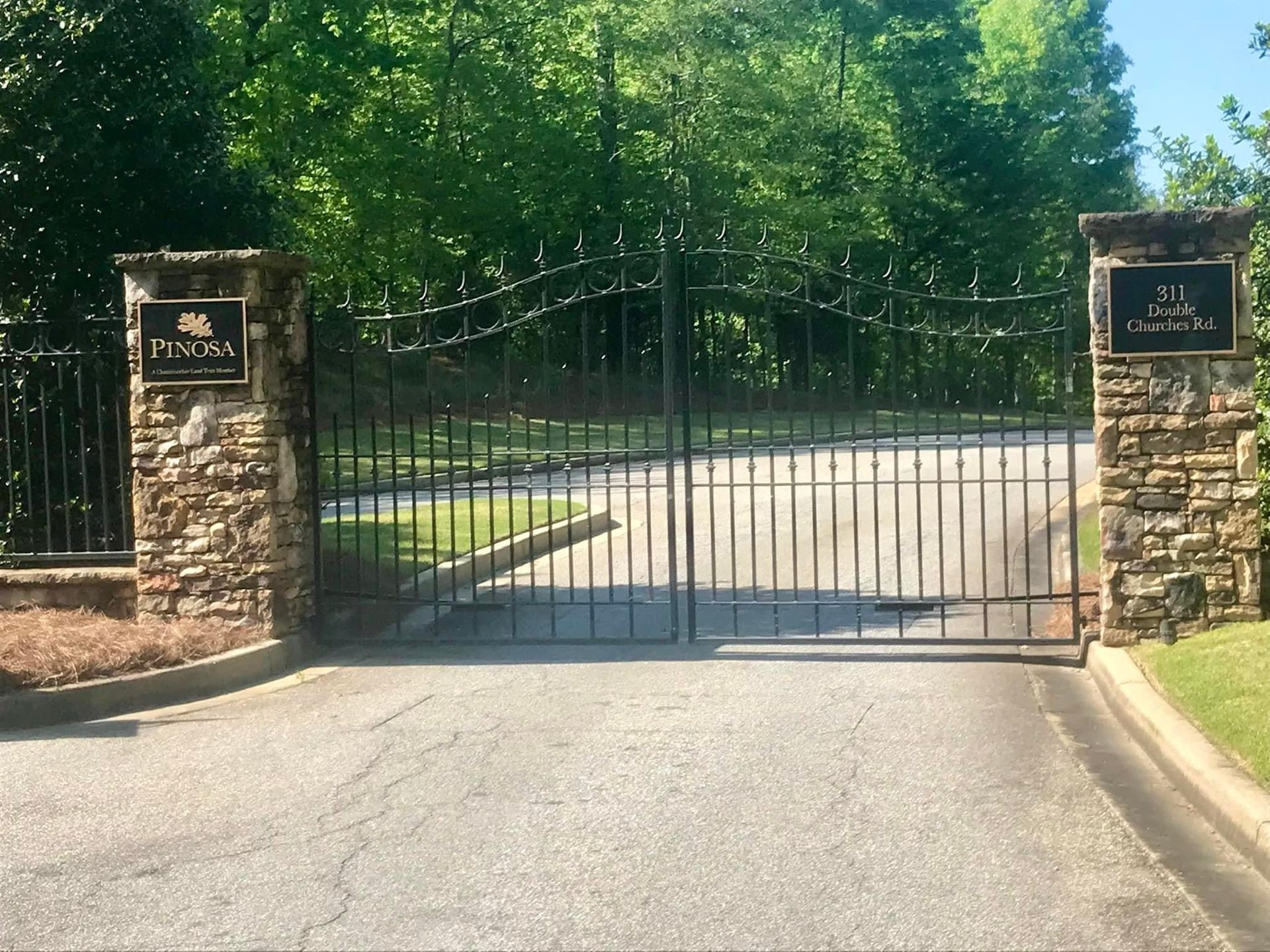 A gate with a sign that says tuscan on it