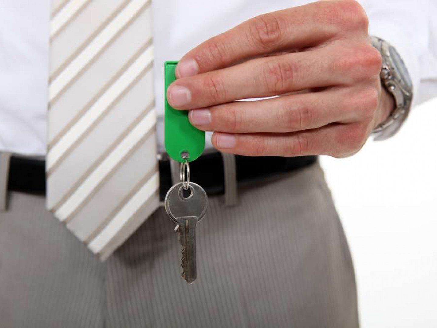 man holding a house key