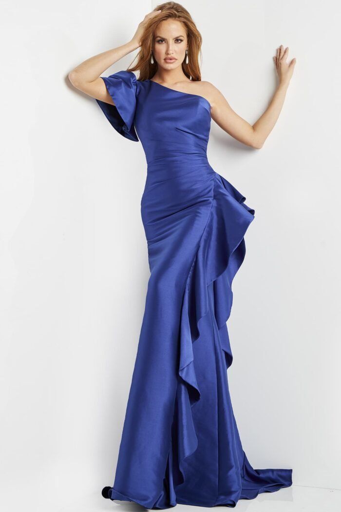 A woman is wearing a blue one shoulder dress with ruffles