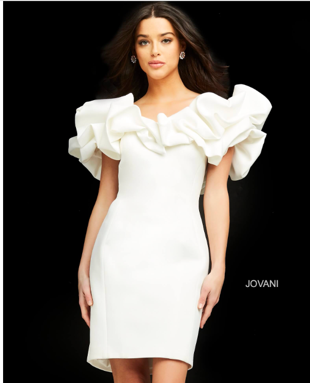 A woman is wearing a white dress with ruffled sleeves