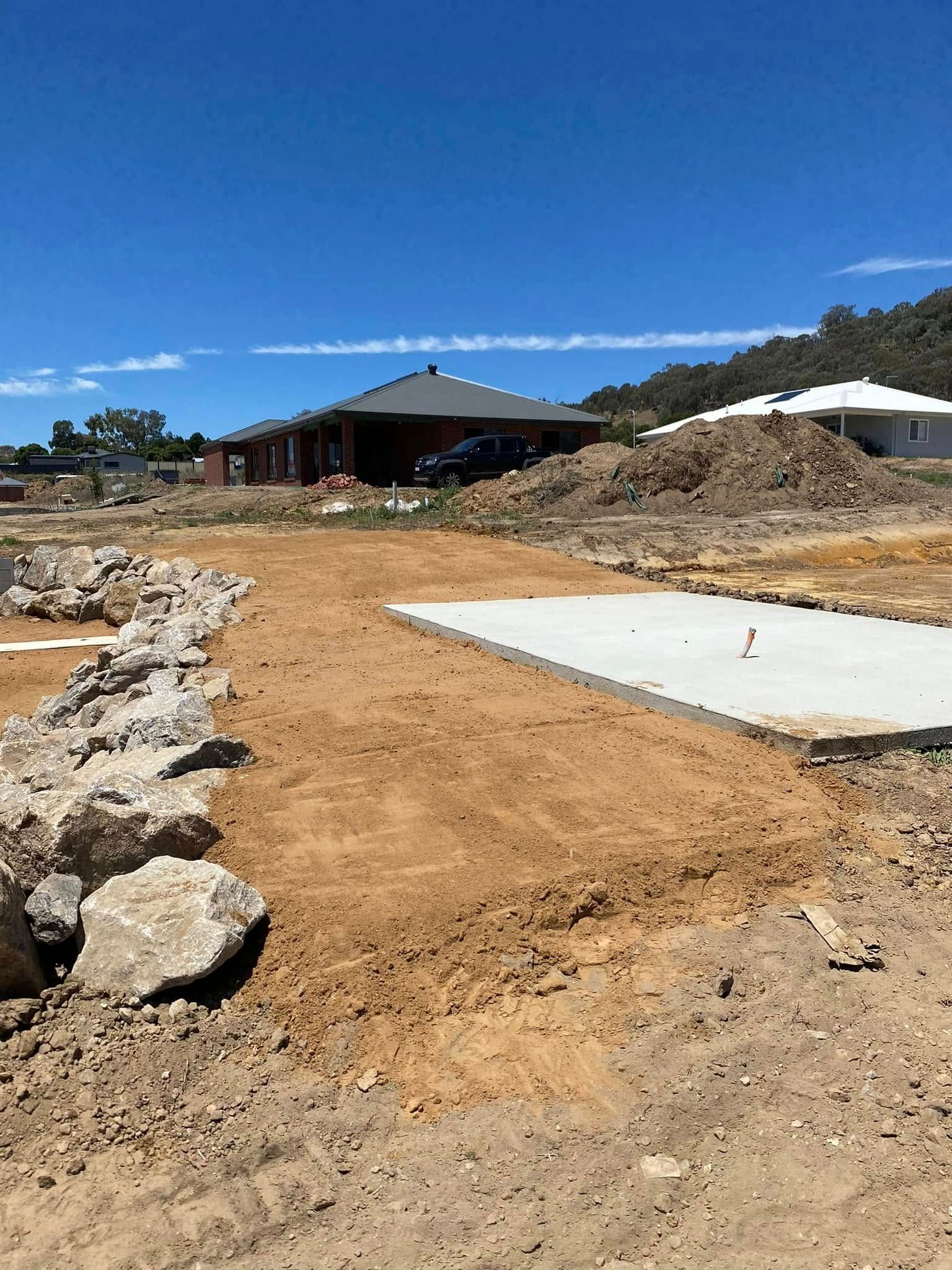 Construction Site with Dirt, Rocks, and A Concrete Slab — Robbo's Hire In Thurgoona, NSW