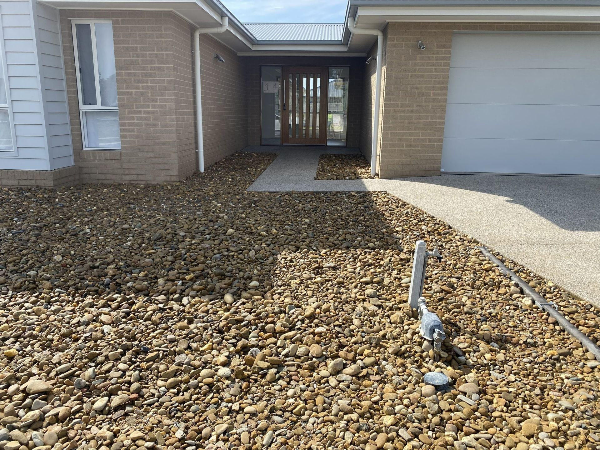Exterior of A House with Gravel Landscaping — Robbo's Hire In Thurgoona, NSW