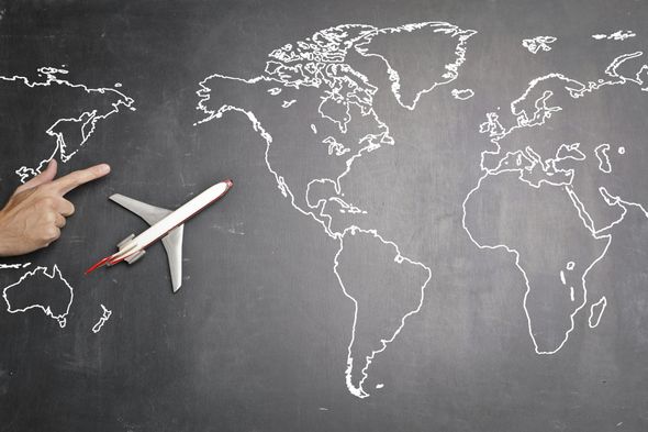 A person is pointing at a plane on a blackboard