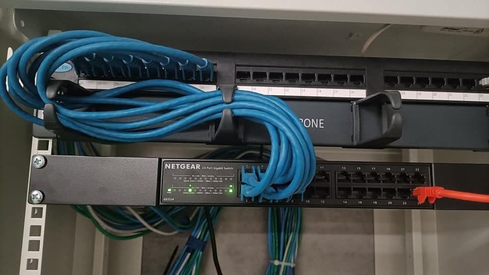 A Rack Of Ethernet Cables In A Cabinet - IT Services in Newcastle, NSW