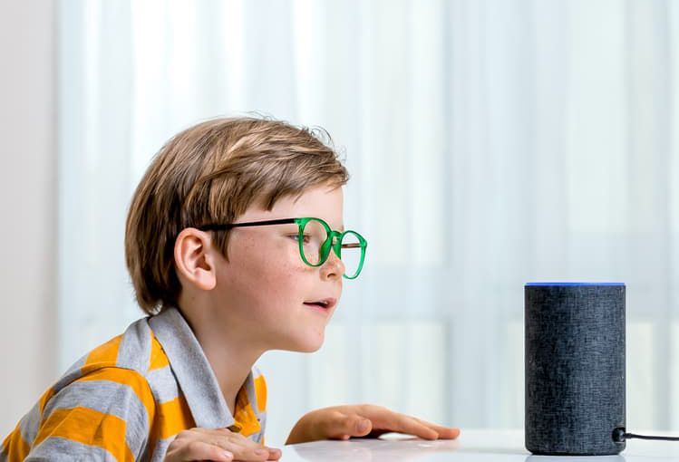 Young Boy Is Looking At An Amazon Echo Speaker - Smart Home Devices Newcastle, NSW