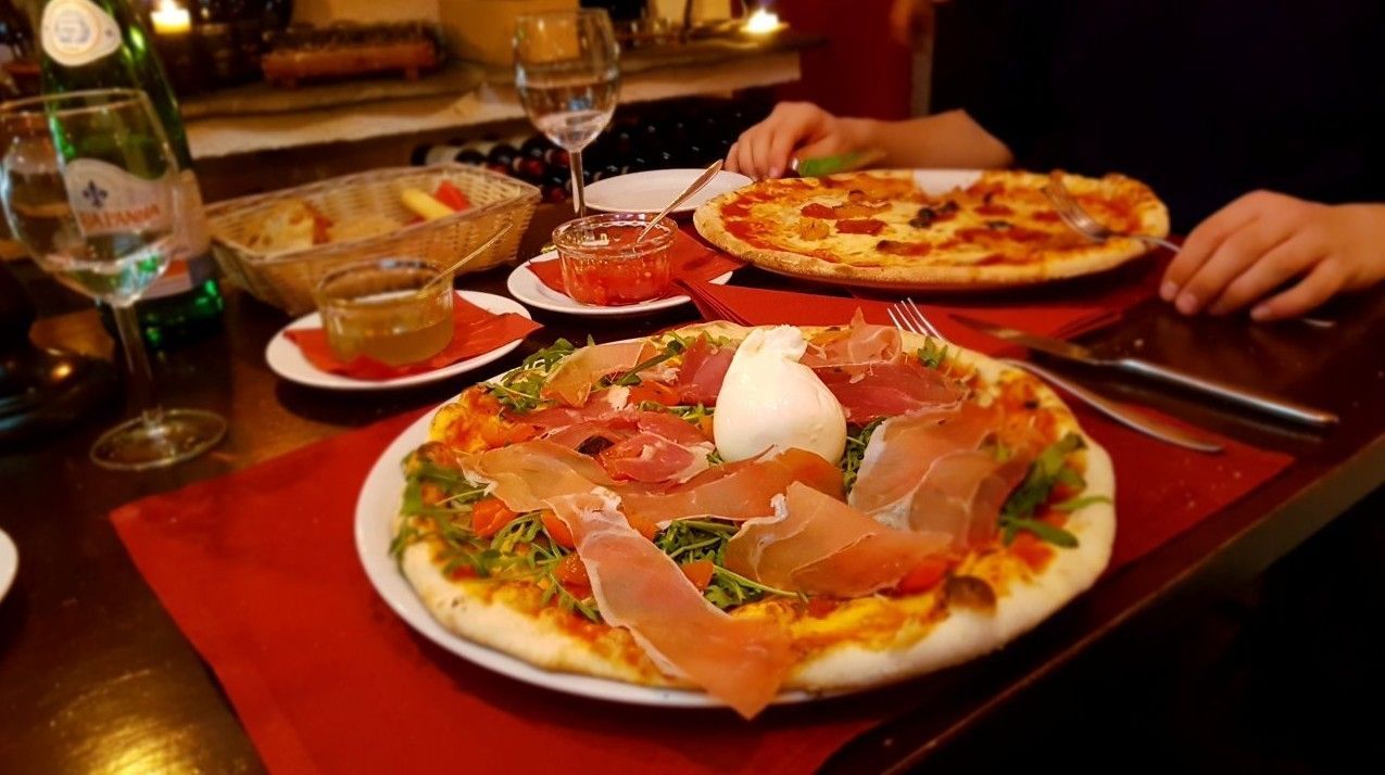 Pizzas baked in a wood-fired oven