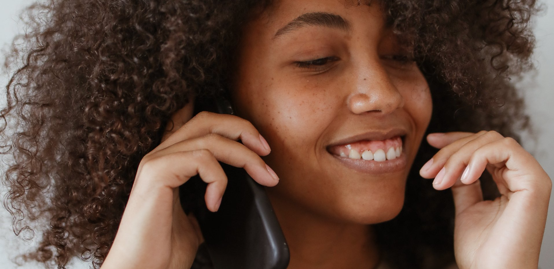 woman on phone image linked to contact page