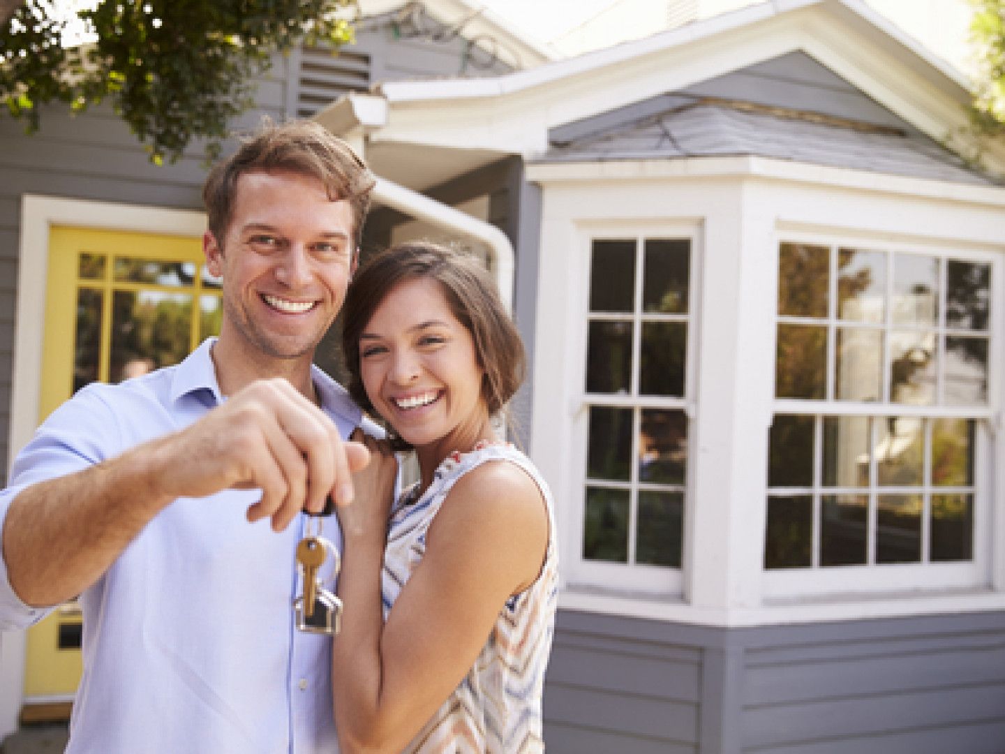 Couple Holding Key To Their New House