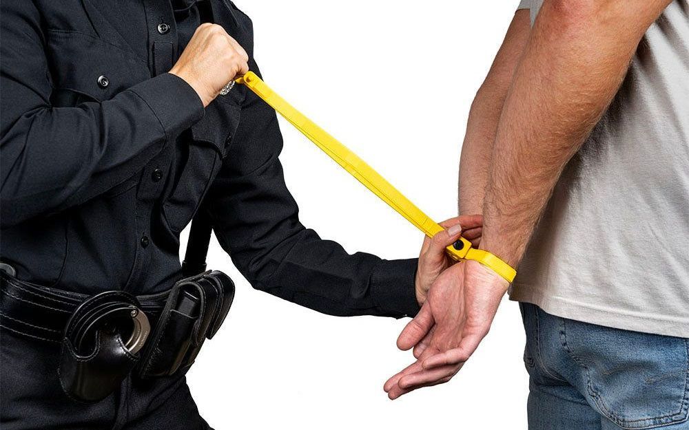 guard restraining a person