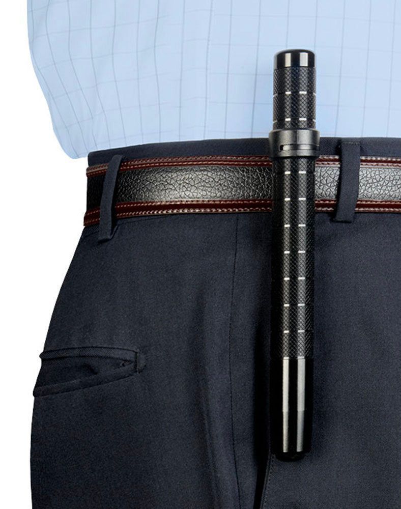 A man wearing a blue shirt and black pants has a baton in his belt