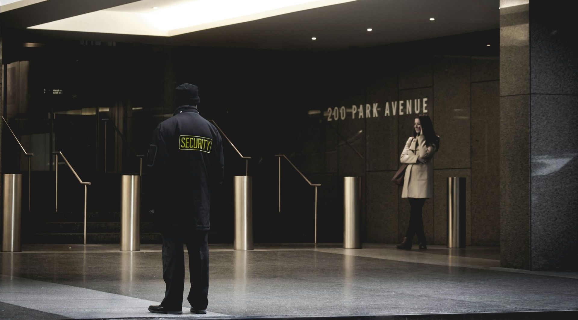 A man standing in front of a building that says 400 park avenue