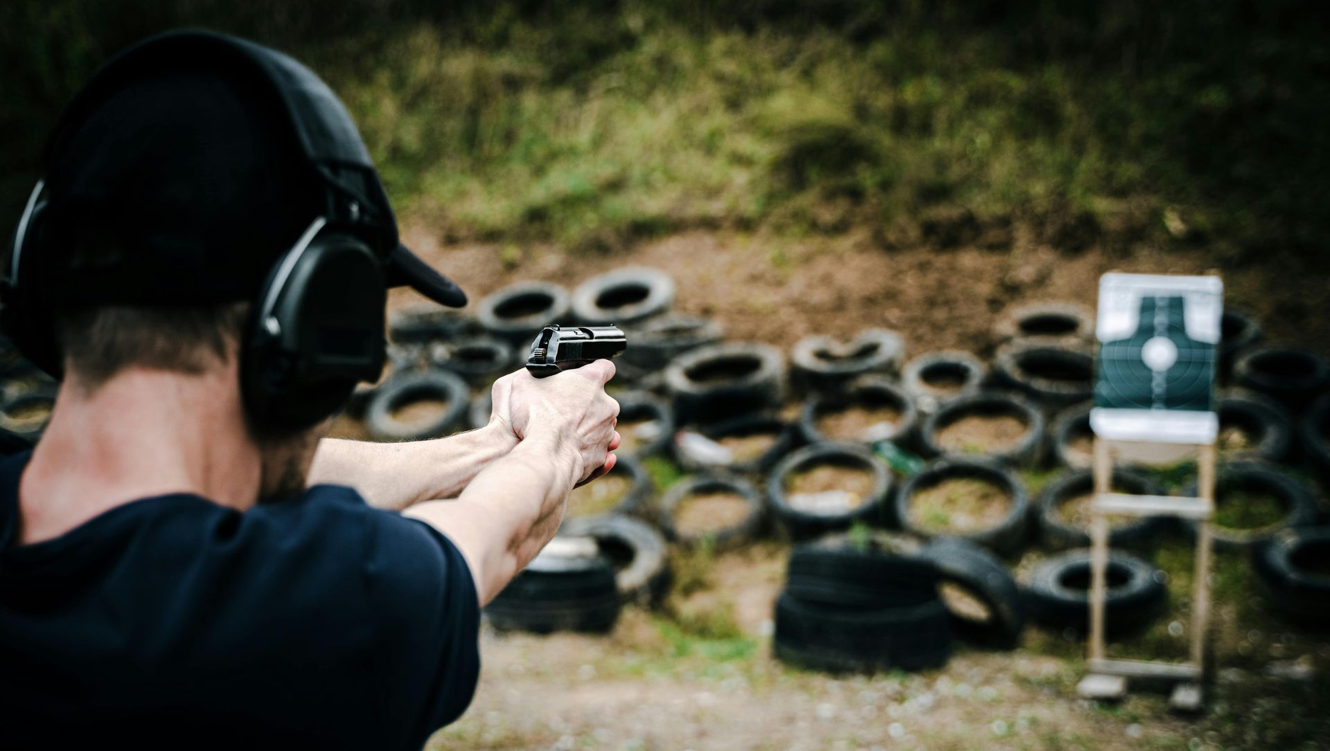 man shooting at a gun range