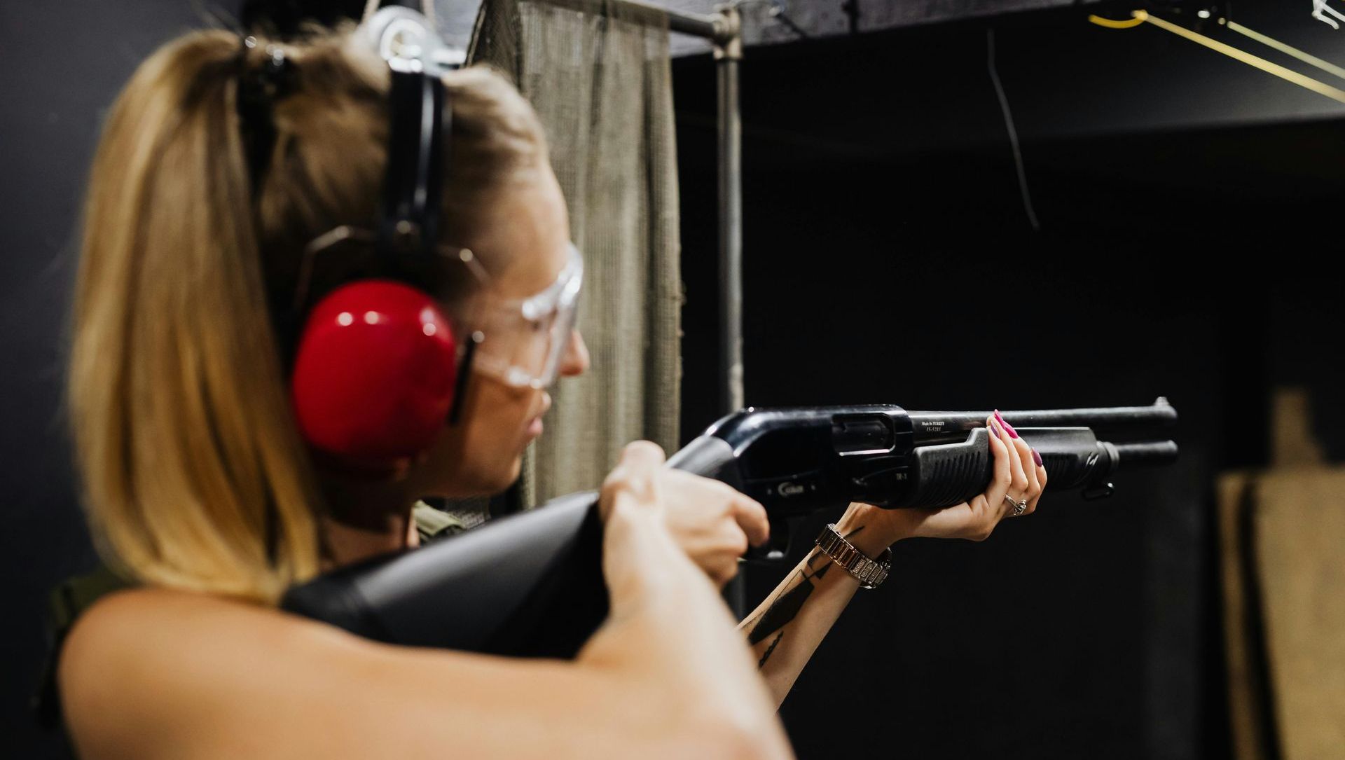 woman shooting a shotgun