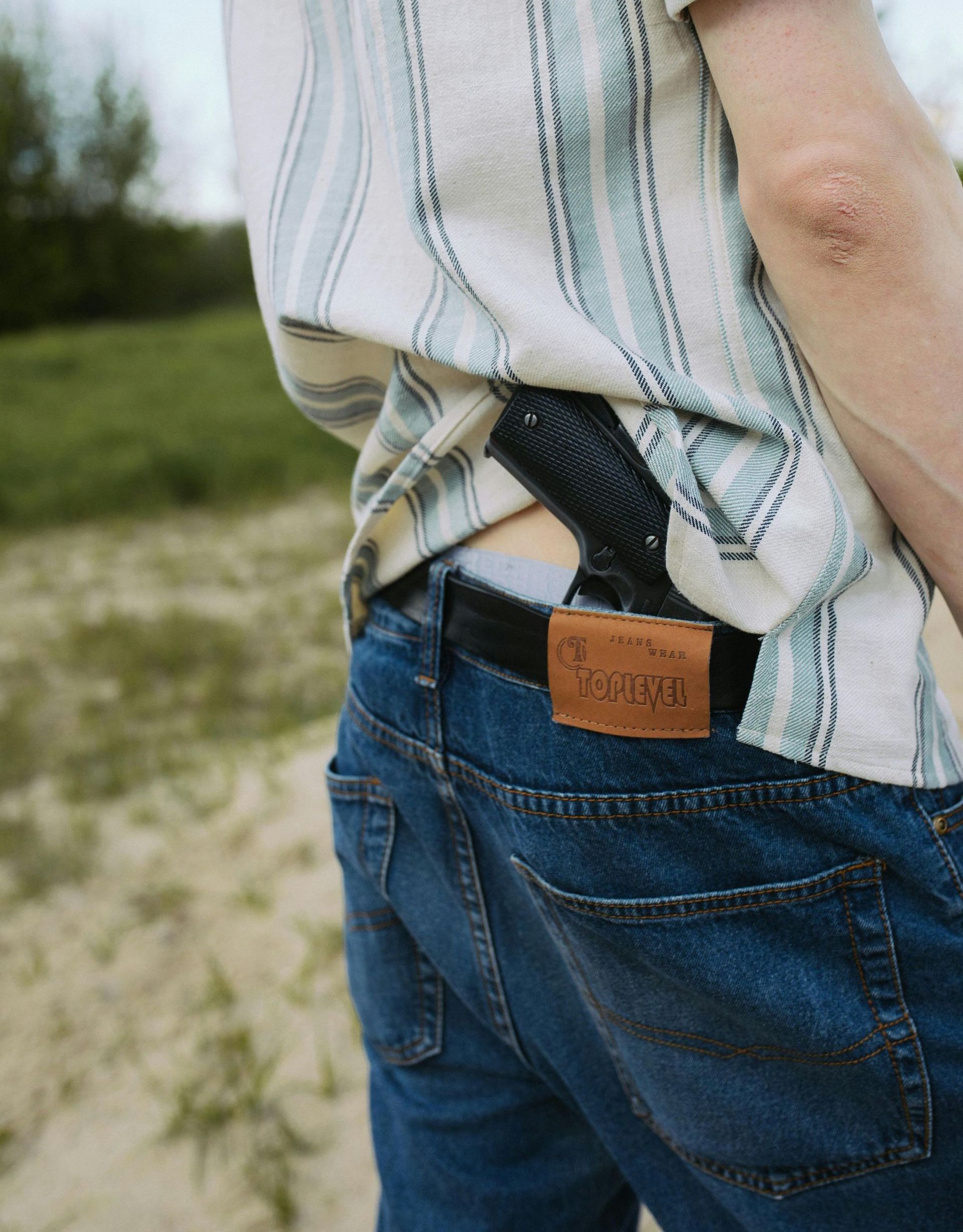 man holding a handgun