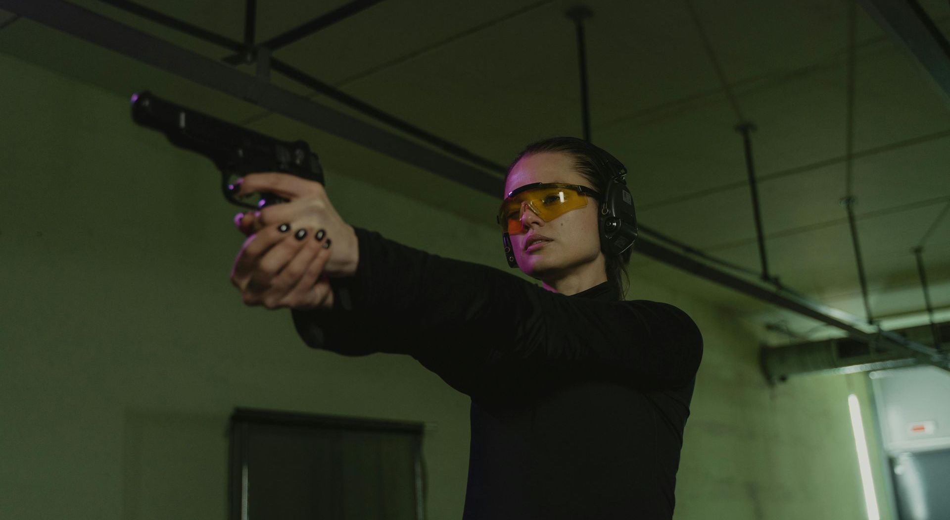 woman firing a handgun