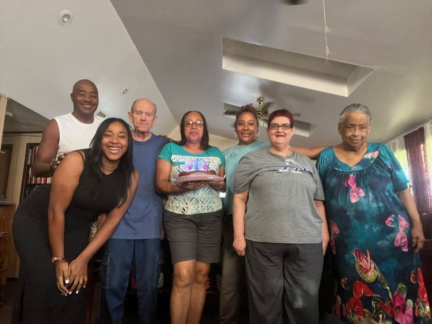 Group photo indoors, community connection and supportive environment