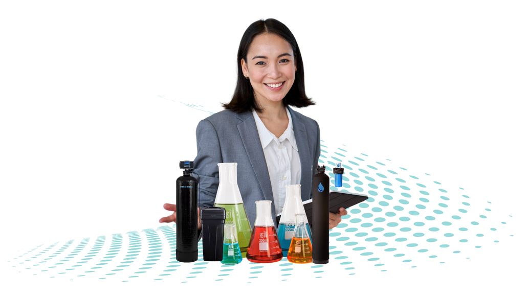 A woman in a suit is standing next to a bunch of bottles and beakers.