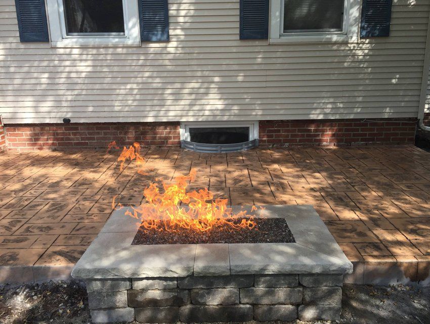 Decorative patio with fireplace — Cedar Rapids, IA — Earthworks Concrete