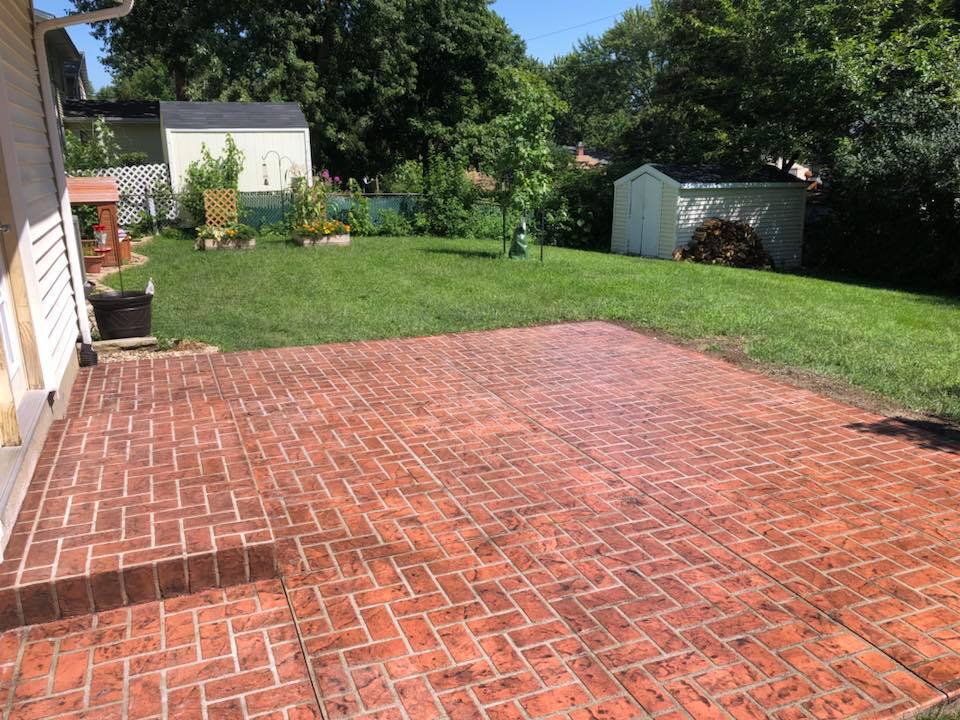 Herringbone brick pattern with old brick color patio — Cedar Rapids, IA — Earthworks Concrete