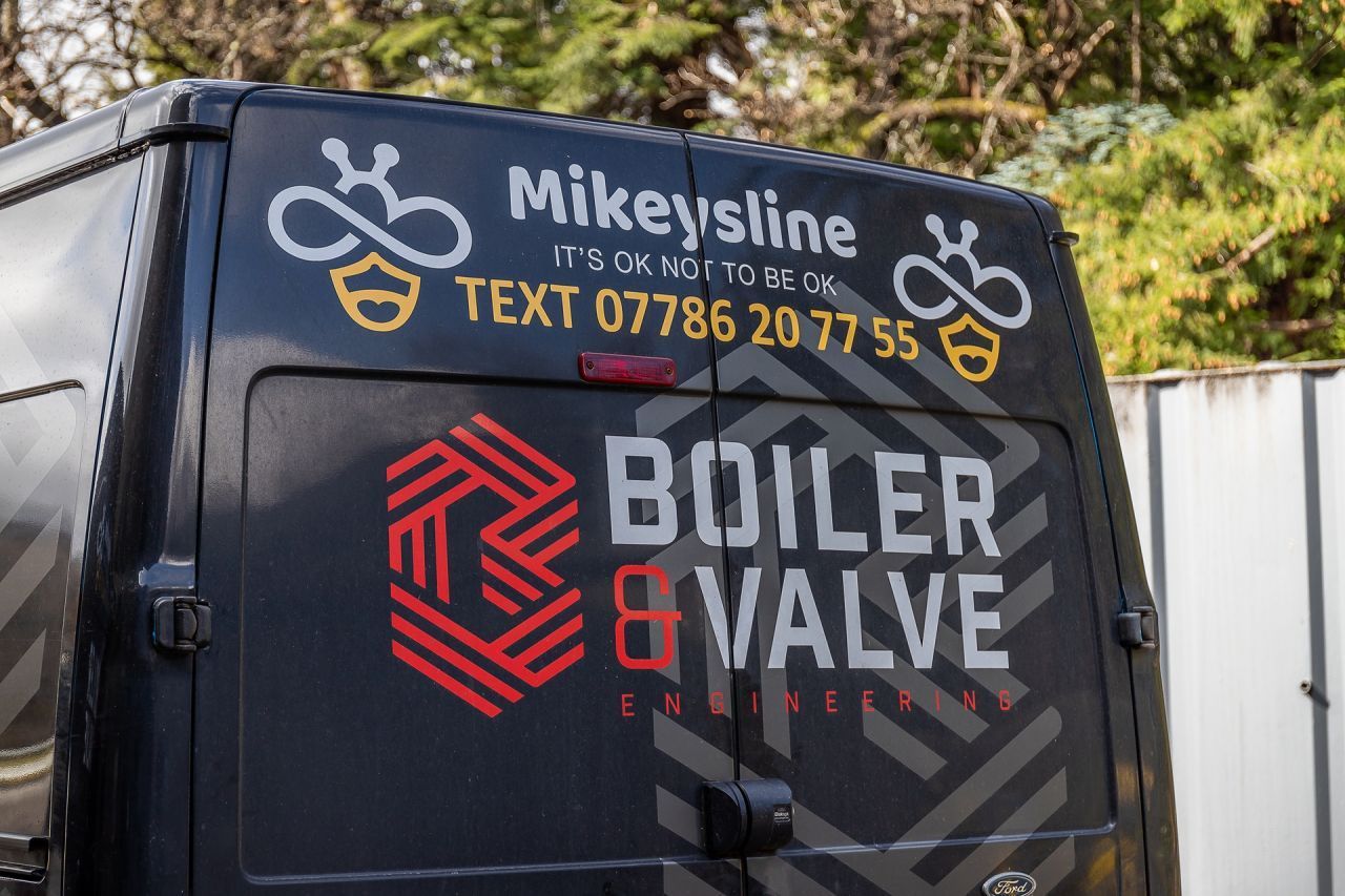 A black van with the word boiler on it
