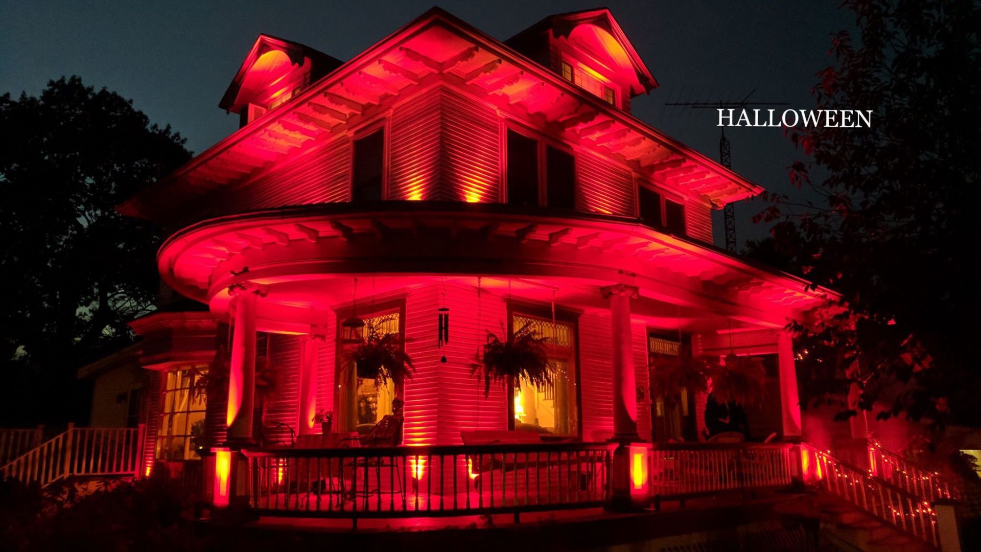Light installation on a residential home during the Halloween