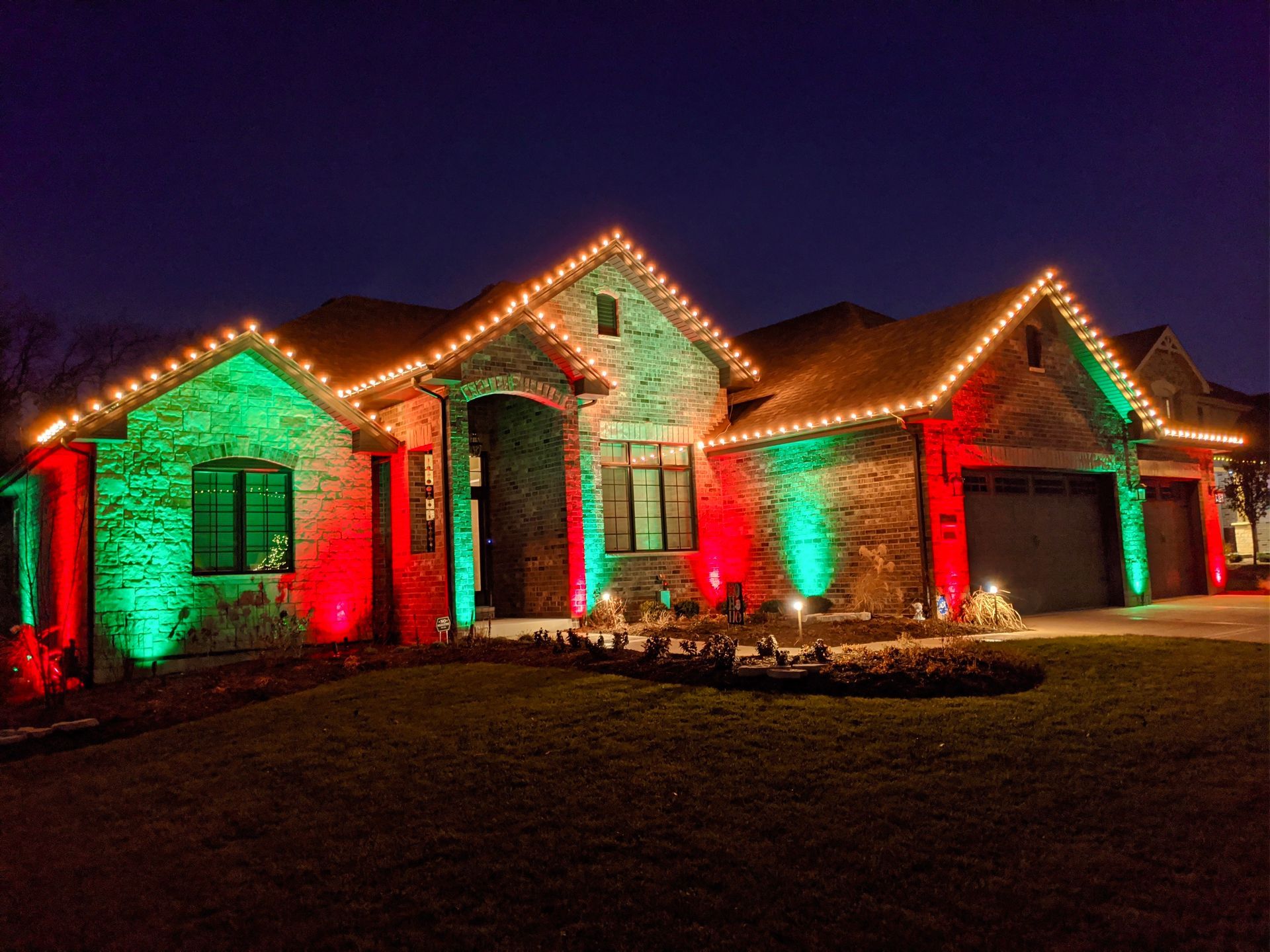 A house with red and green lights on it