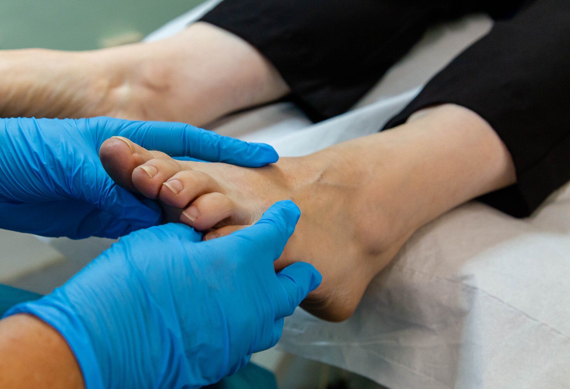 A Podiatrist at York Podiatry Ltd assessing a foot 
