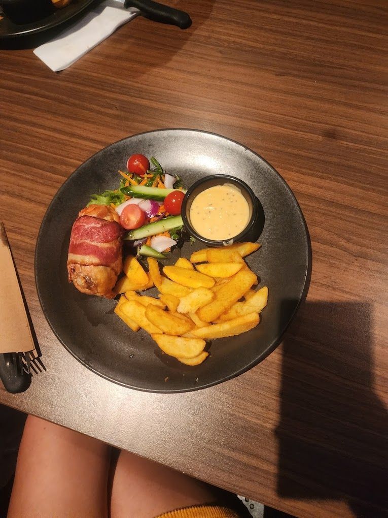 Plate With Bacon-wrapped Potato, Fries, Salad — Capricorn Tavern in Taranganba, QLD