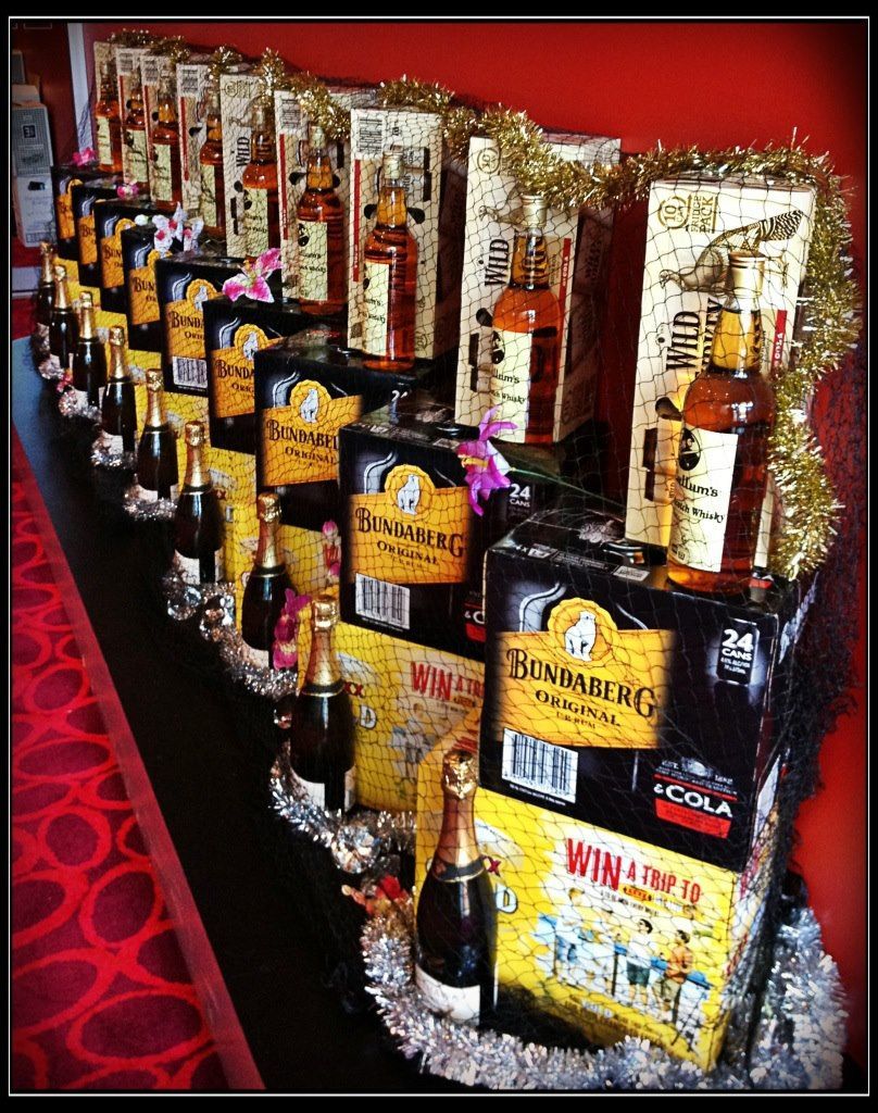 Bottles of Liquor, Champagne, and Gift Boxes Arranged on a Long Table — Capricorn Tavern in Taranganba, QLD