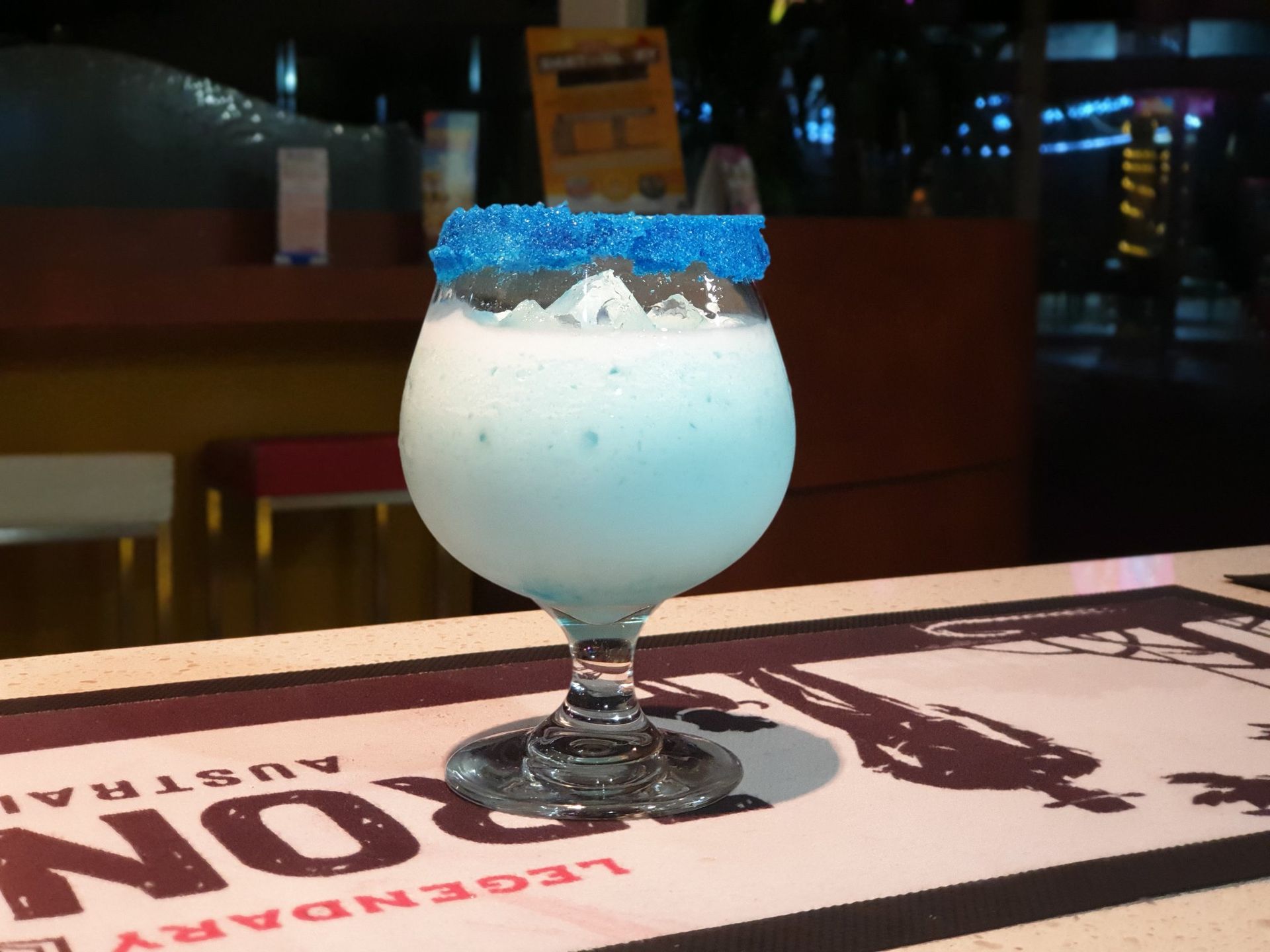 Blue Cocktail With Sugared Rim on a Bar — Capricorn Tavern in Taranganba, QLD