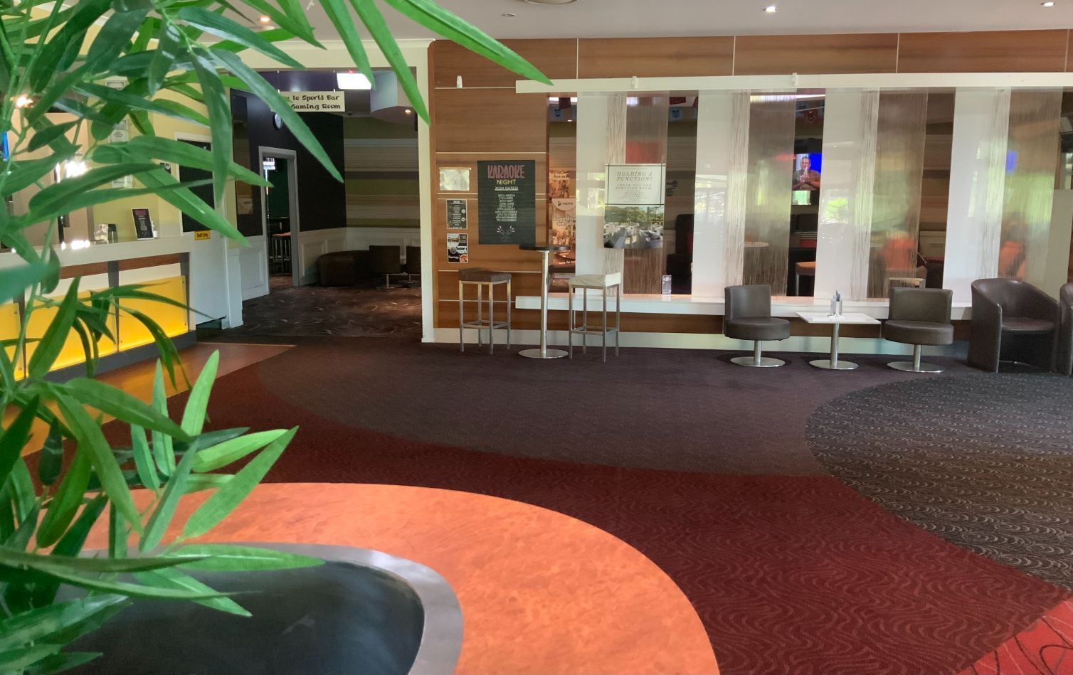 Interior of a Lounge With Seating Areas, Tables, and a Bar — Capricorn Tavern in Taranganba, QLD