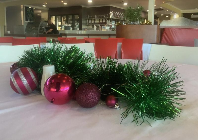 Christmas Decorations on a White Tablecloth in a Restaurant — Capricorn Tavern in Taranganba, QLD