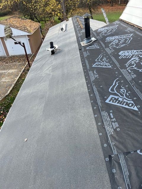 A roof with a rhino brand roofing material on it.