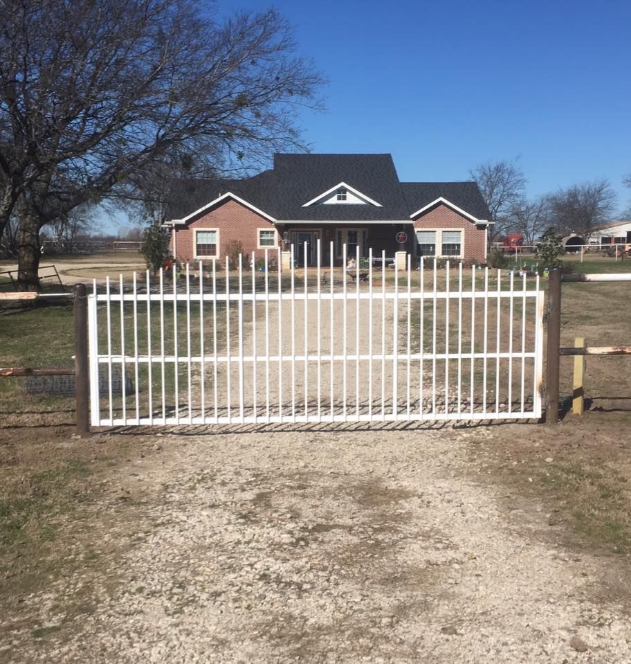 A house with a white gate in front of it
