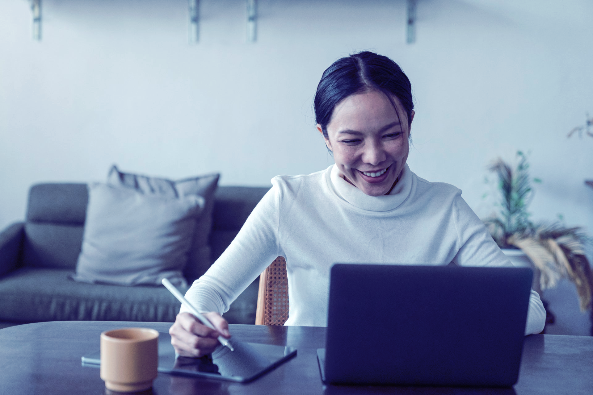 woman smiling on laptop