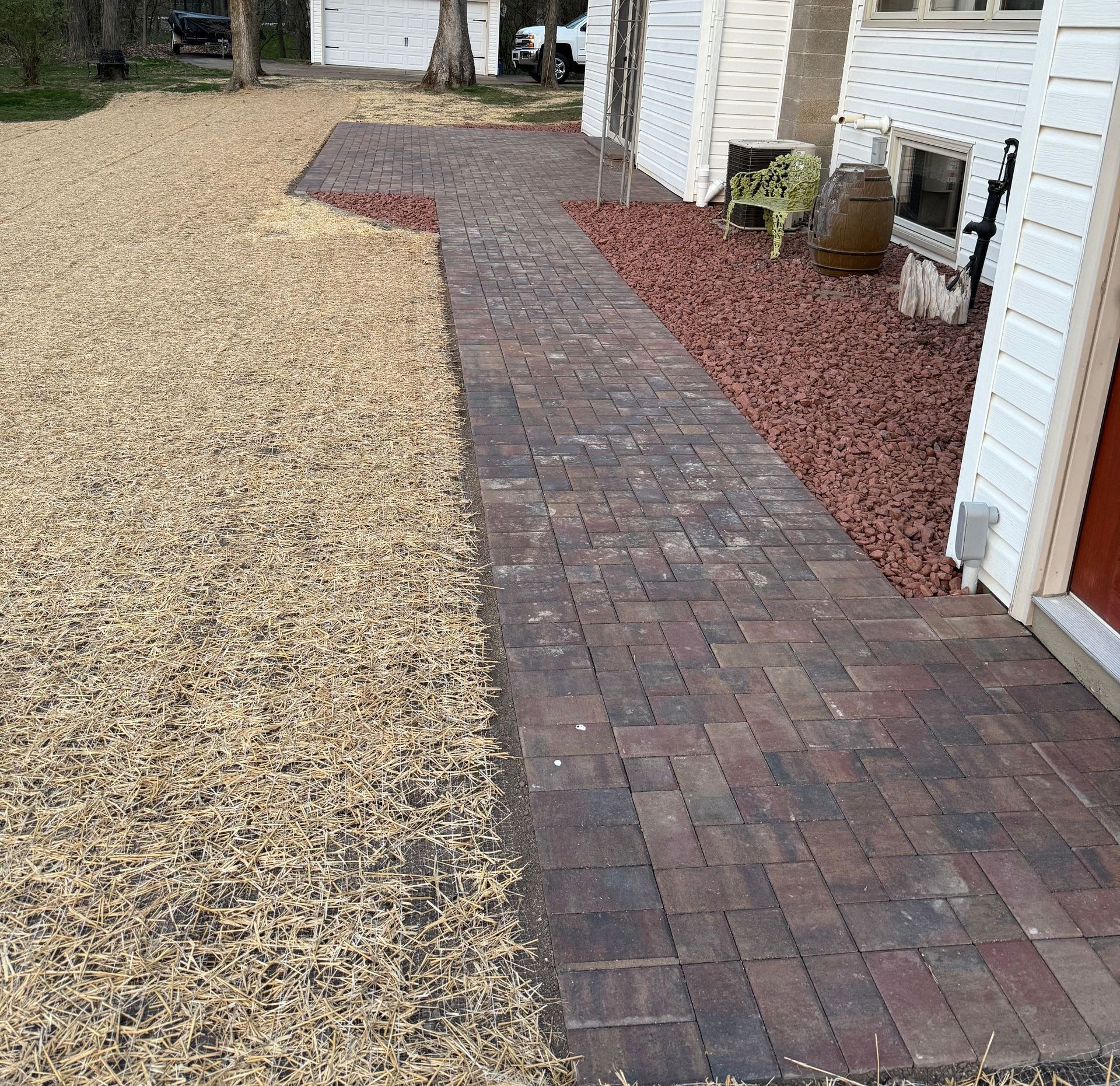 A brick walkway with a view of the ocean