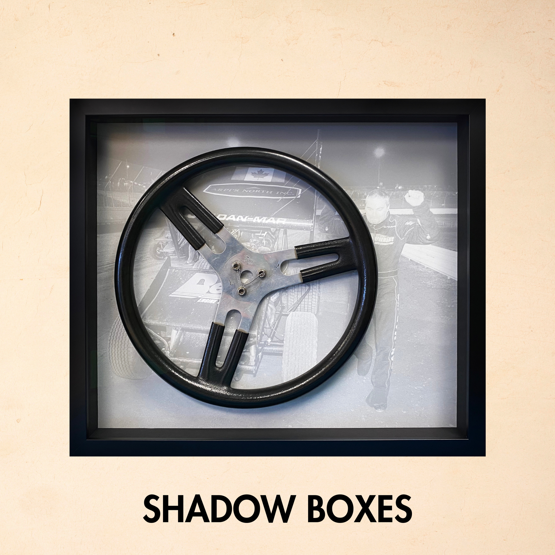 A picture of a steering wheel in a shadow box