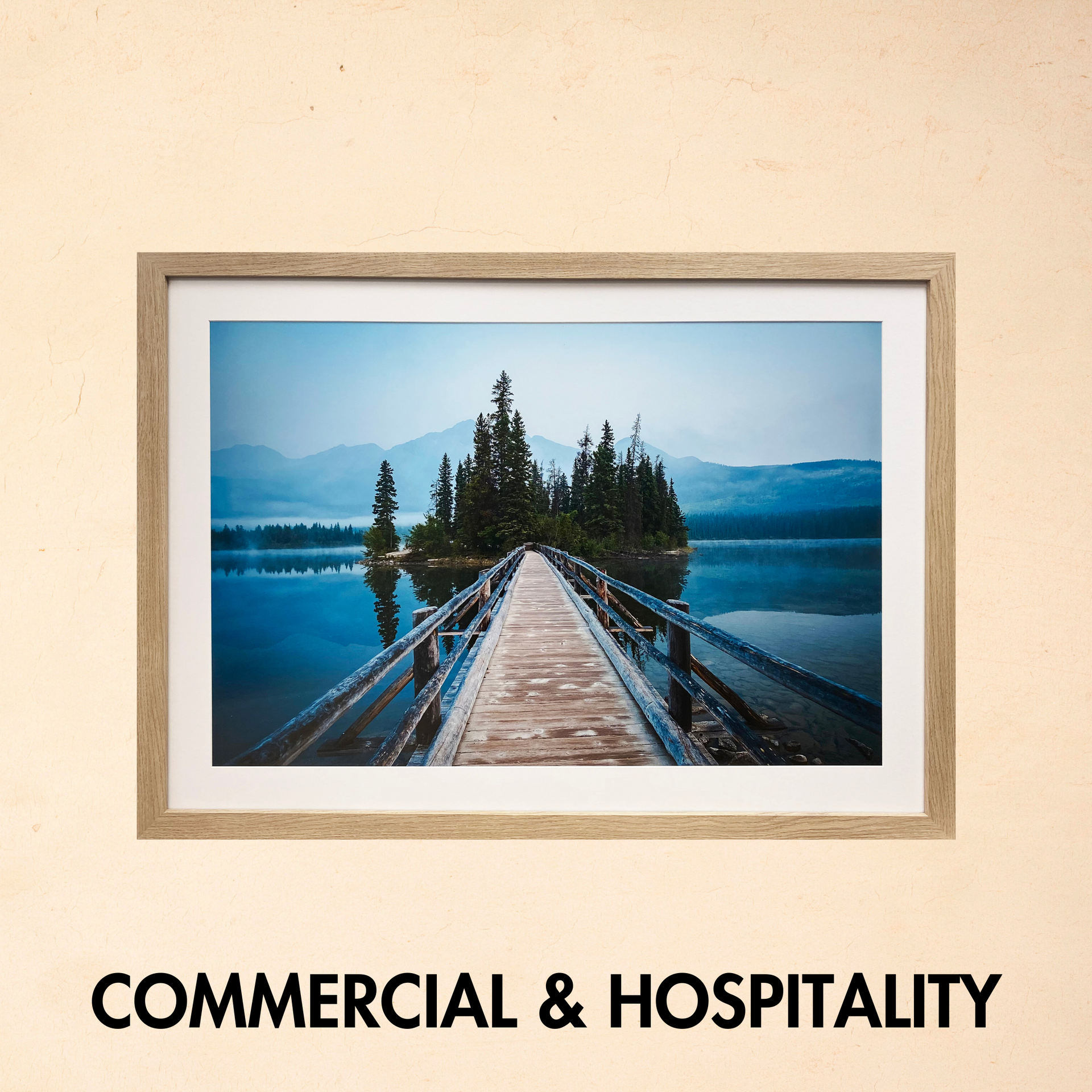 A picture of a bridge over a lake with the words commercial & hospitality below it