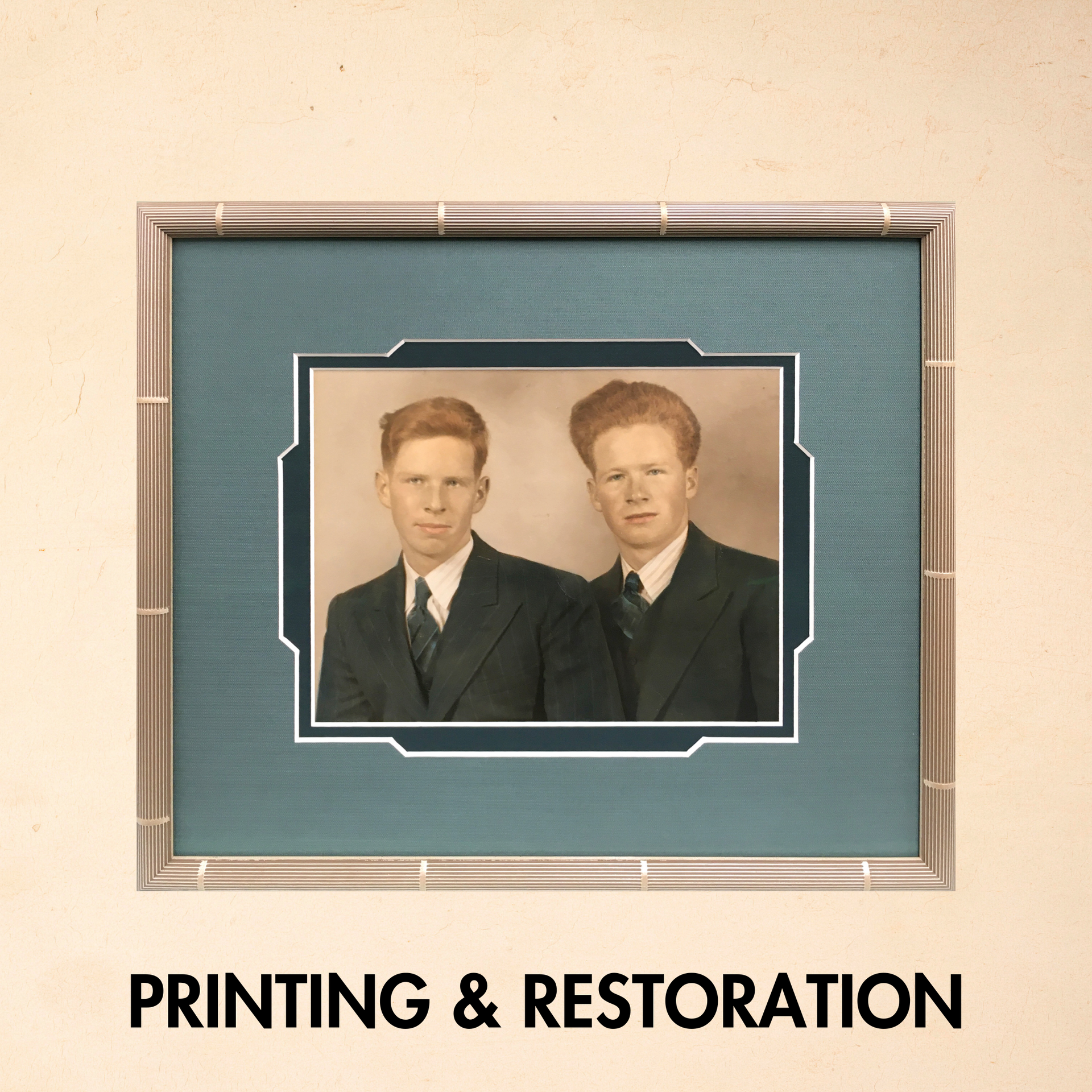 A framed picture of two men with the words printing and restoration below it