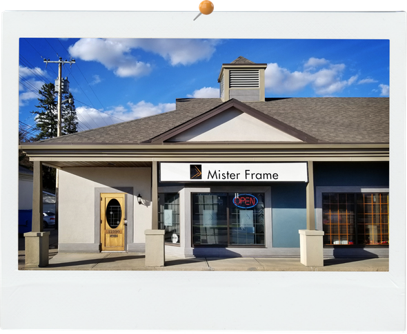 A building with a sign that says mister frame